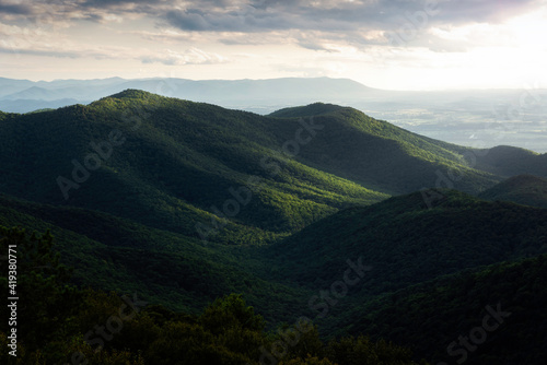 Sunlight illuminating the slopes of a mountain in Shenandoah National Park during the late afternoon viewed from Blackrock Summit.