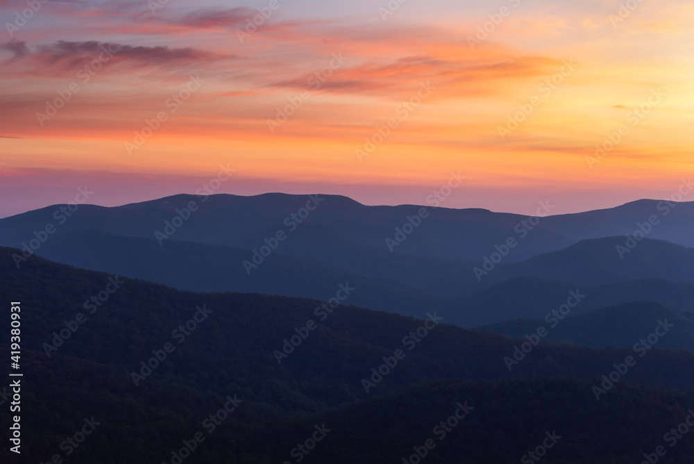Gorgeous classic layers of mountains at sunrise in Shenandoah National Park during the Summer.