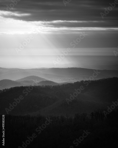 Rays of sunlight creating pockets of light and shadow down in the valleys of Shenandoah National Park.