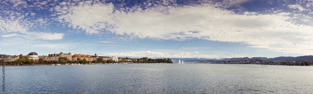 Panoramic view of historic Zurich city center with famous Opera House at Lake Zurich on a sunny day with clouds in summer, Canton of Zurich, Switzerland
