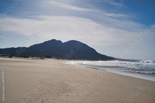 Beach view with hill in the background