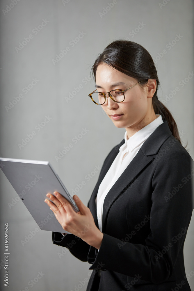 businesswoman with tablet and file businesswoman with tablet and file
