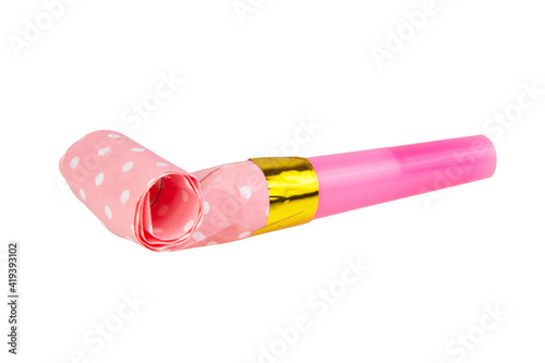 Rolled pink festive noisemaker or party whistle horn isolated on the white background