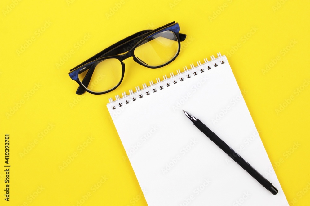 pen and glasses with notebook pen and glasses with notebook