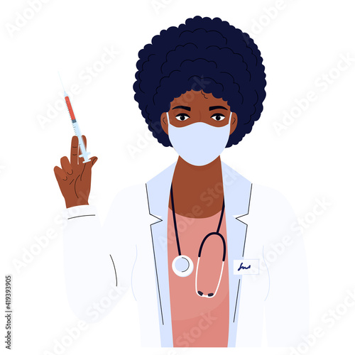 Female doctor. African American woman in a white gown and protective mask. Hospital staff