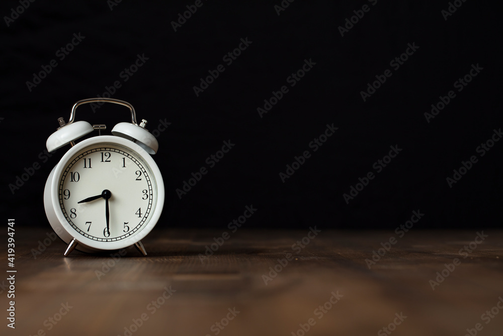 Retro alarm clock on wooden background. back to work and school concept. Retro alarm clock on wooden background. back to work and school concept.