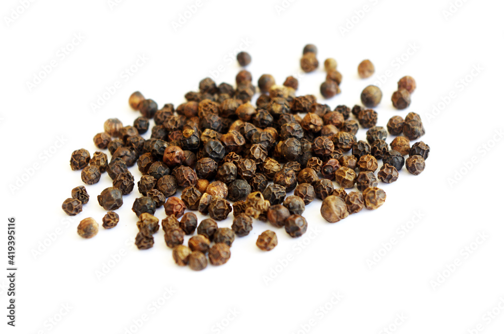 Heap of black pepper on white background. Fragrant black pepper,black peppercorn , indian spice-on white acrylic background. Heap of black pepper on white background. Fragrant black pepper,black peppercorn , indian spice-on white acrylic background.