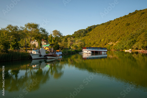 Agva, Sile, Istanbul, Turkey. It's a popular place place and resort destination on Goksu river. Reflection of trees. Reflections in the water. photo