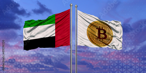 The UAE and Bitcoin flags are waving over the blue sky