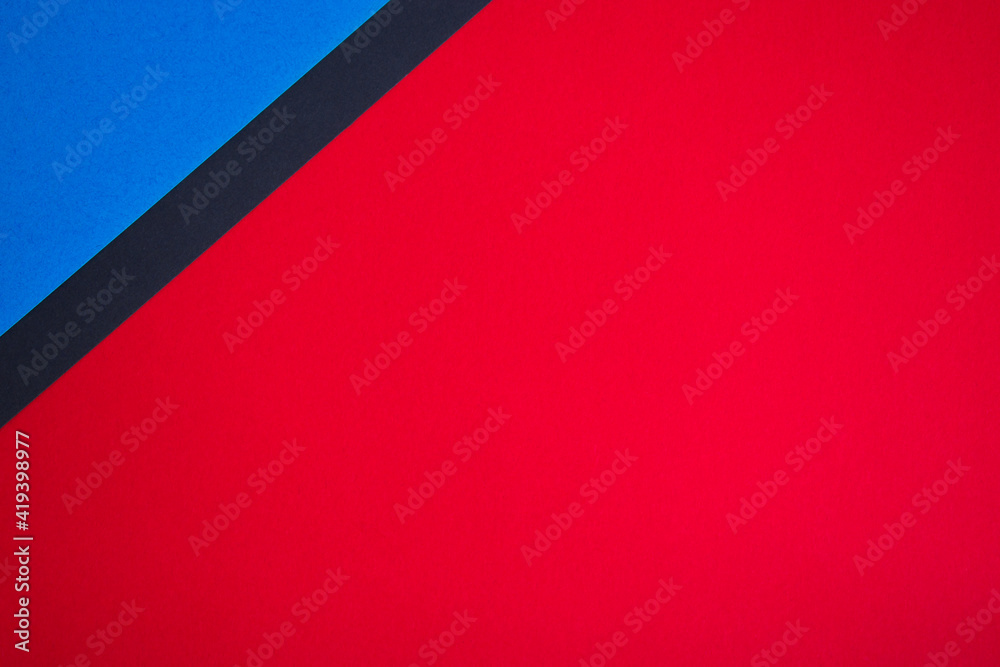 Red, blue and black colored paper abstract background