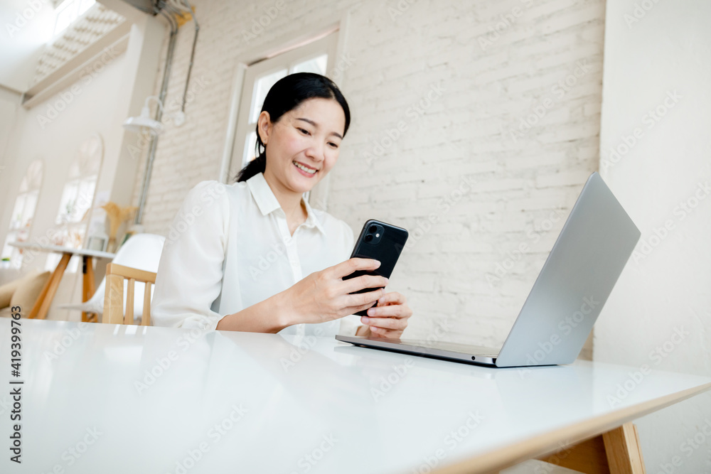 woman work using texting cell phone typing computer.student study education online learning.adult professional chatting on laptop,mobile contact us at Thinking business plan.connecting people concept woman work using texting cell phone typing computer.student study education online learning.adult professional chatting on laptop,mobile contact us at Thinking business plan.connecting people concept