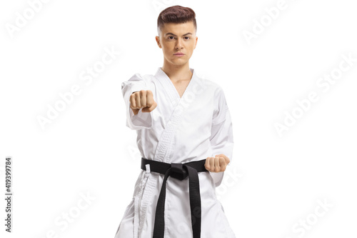 Teenage boy exercising karate kata