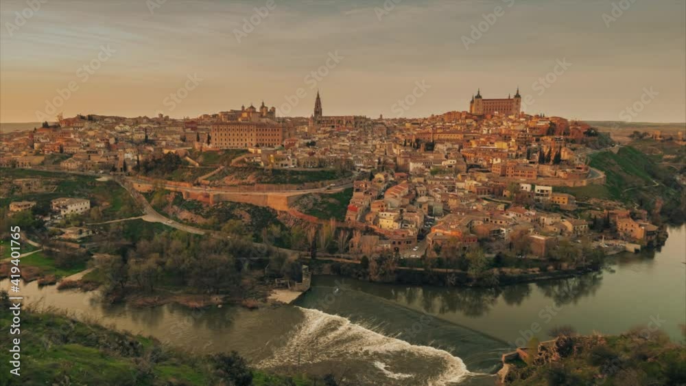 Time-lapse above aerial drone point of view Toledo historical picturesque city of Spain surrounded by Tagus river located on hilltop, day evening scene view. Castilla–La Mancha. Timelapse hyper lapse 