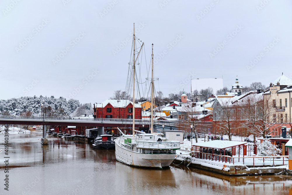 View of the Porvoonjoki embankment and old ship from the bridge, Porvoo, Finland.