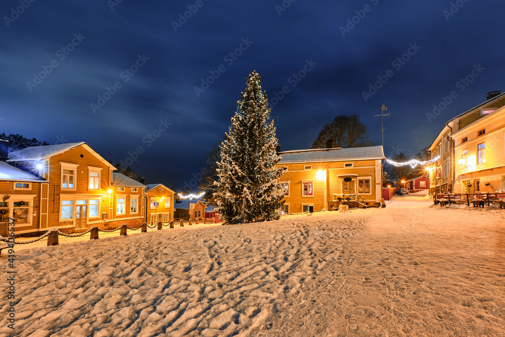 Christmas tree on the Market Square in Old Porvoo in winter snowy night, Finland.