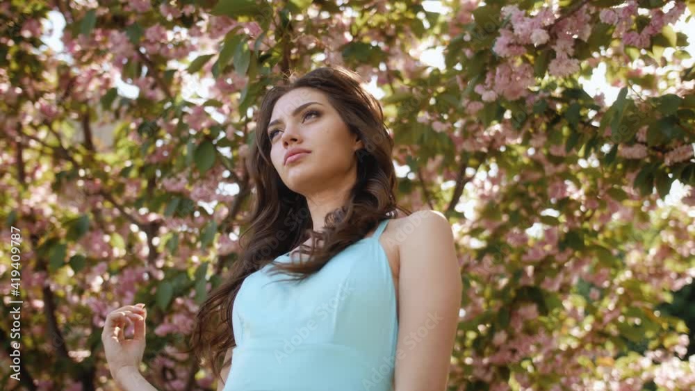Woman at Blossoming Sakura Tree on Nature Woman at Blossoming Sakura Tree on Nature