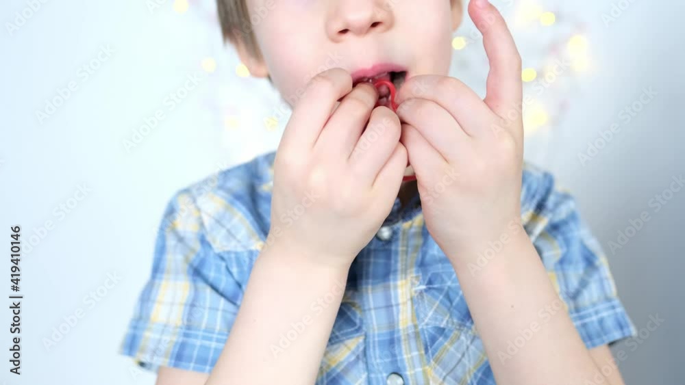 little child, kid eating sweet gelatin candies, looking forward to enjoying his favorite treat, unhealthy food concept, halal gelatin, diet little child, kid eating sweet gelatin candies, looking forward to enjoying his favorite treat, unhealthy food concept, halal gelatin, diet
