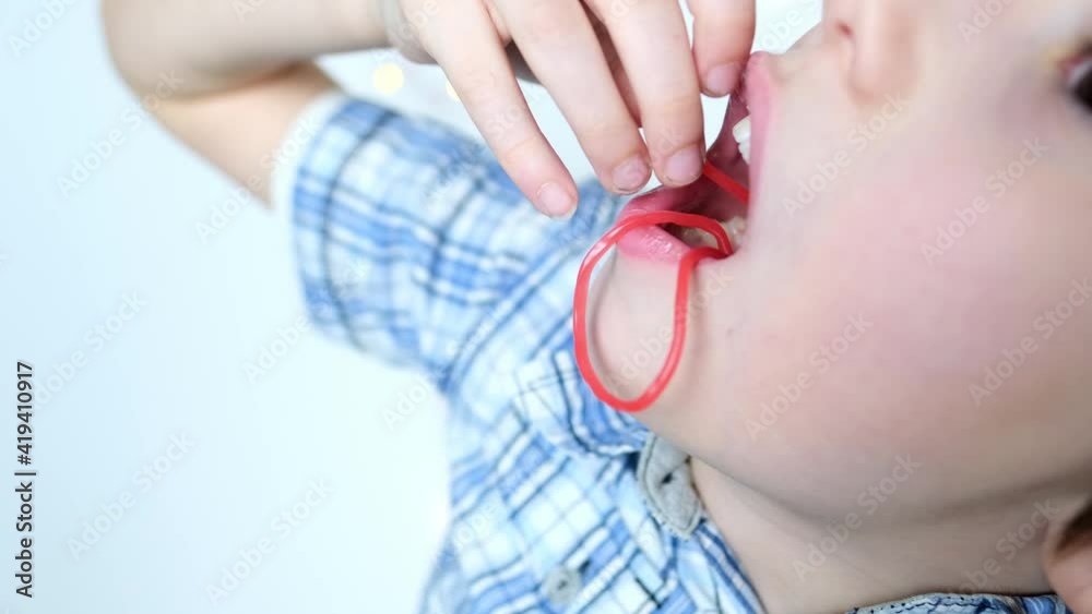 little child, kid eating sweet gelatin candies, looking forward to enjoying his favorite treat, unhealthy food concept, halal gelatin, diet