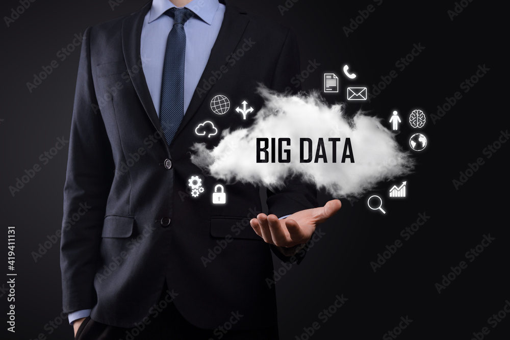 Businessman holds the inscription BIG DATA. Padlock , brain ,man, planet,graph, magnifier, gears, cloud, grid, document, letter, phone icon. Businessman holds the inscription BIG DATA. Padlock , brain ,man, planet,graph, magnifier, gears, cloud, grid, document, letter, phone icon.