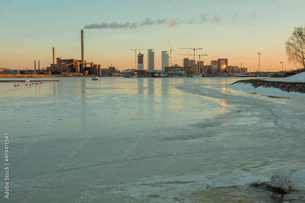 Finland, Helsinki, March 3, 2021.     Dawn, Spring panorama of Helsinki, view of the Katajanokka and Krununhakka districts in the foreground the Gulf of Finland