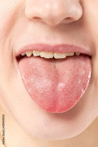 open mouth tongue lips of a young girl close up