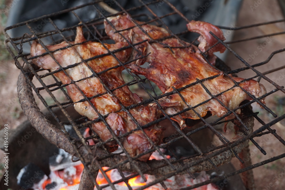 Grilled rats on a charcoal grill with a secondary grill Is local food by the countryside