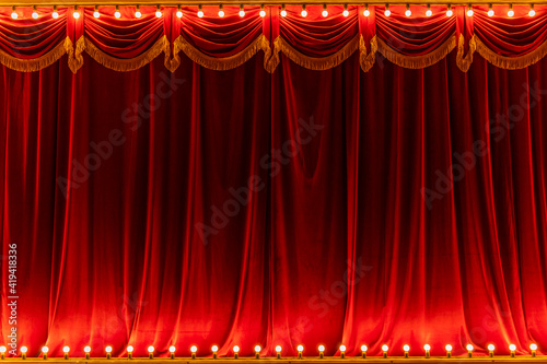 Theater red curtain and neon lamp around border photo