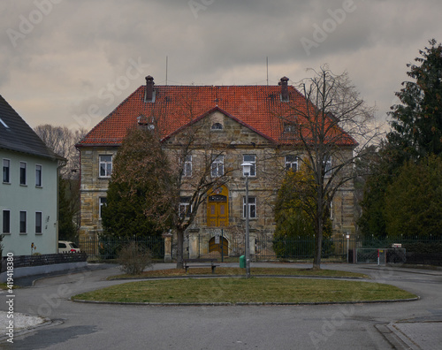 Old historic building in german village under grey sky