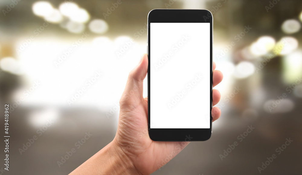 Hand holding smartphone device touching screen Hand holding smartphone device touching screen