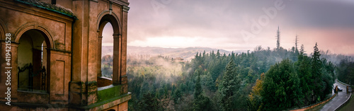 panoramic view of Colli Bolognesi hills at sunset from the arcades San Luca basilica, horizontal background of Bologna in Italy photo