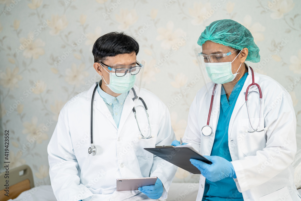 Asian doctor team consult for motivation new normal to treat infection Covid-19 Coronavirus at hospital ward. Asian doctor team consult for motivation new normal to treat infection Covid-19 Coronavirus at hospital ward.