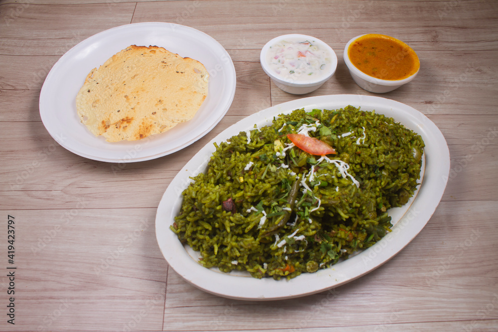 Spinach rice on a cookie on a light background, green rice, healthy vegetarian cuisine Spinach rice on a cookie on a light background, green rice, healthy vegetarian cuisine