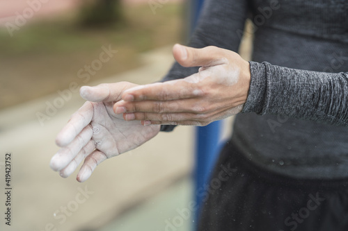 Selective focus shot of a male's chalky hands