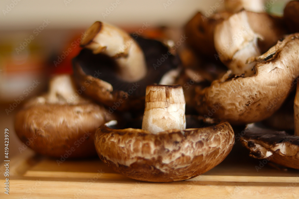 Mushrooms over kitchen wooden board. Healthy food concept. Mushrooms over kitchen wooden board. Healthy food concept.