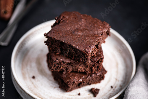 Chocolate brownies stack on a plate. Rich dark chocolate brownies