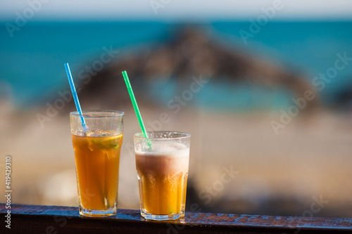 cocktail on the background of the sea and the beach	
