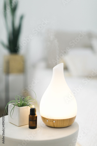 Obraz na plátně Essential oil diffuser in modern home setting