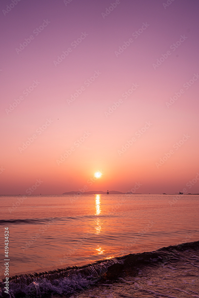 Tropical sunrise over sea and beach in Thailand. purple filter