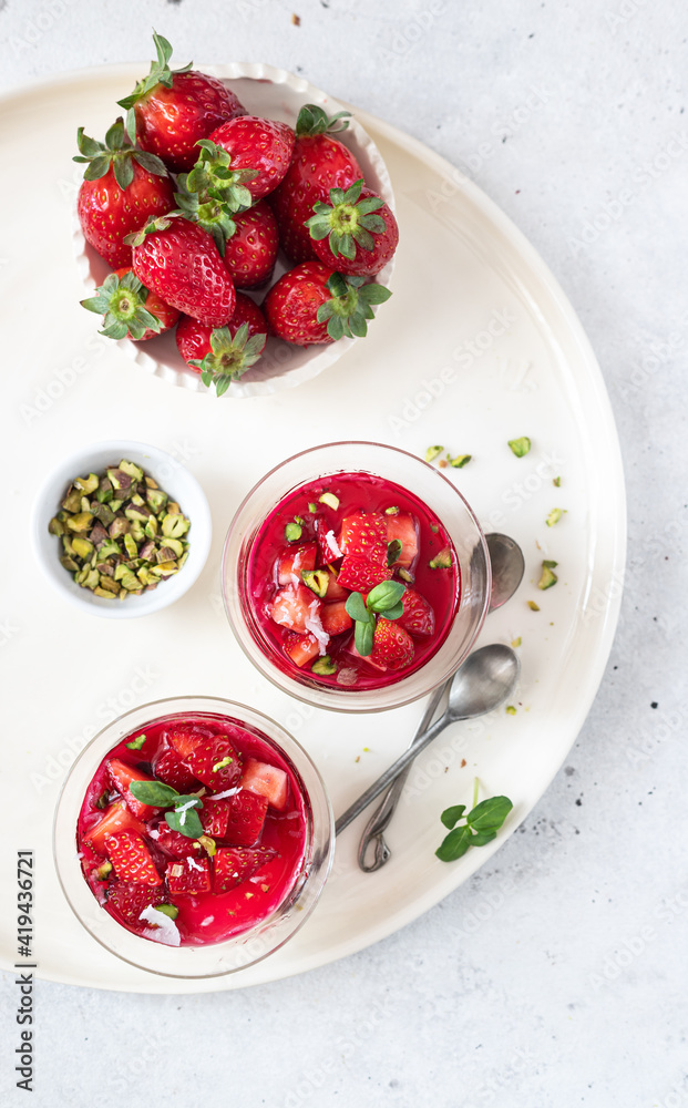 Malabi (muhallebi) milk pudding with strawberries and pistachios. Arabic desert Malabi (muhallebi) milk pudding with strawberries and pistachios. Arabic desert
