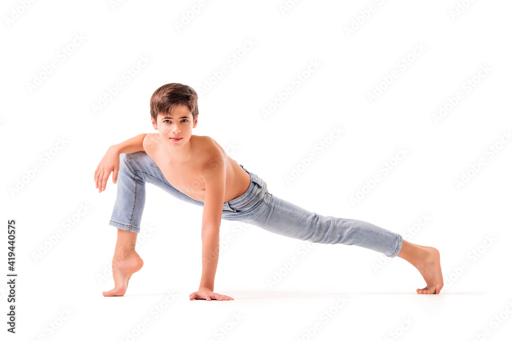 A teenage ballet dancer poses barefoot, isolated on a white background. A teenage ballet dancer poses barefoot, isolated on a white background.
