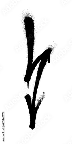 Graffiti arrow with overspray in black over white.