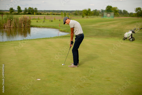 Young man playing golf