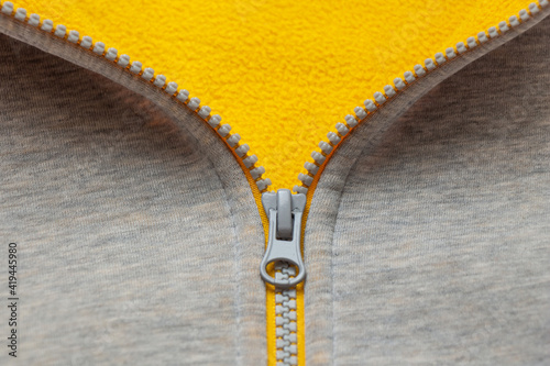 The color concept of 2021. The fabric is yellow and gray. The zipper for sewing is gray.