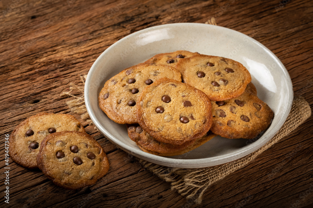 Delicious chocolate cookies on wooden table. Delicious chocolate cookies on wooden table.
