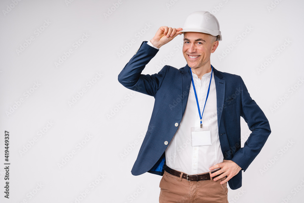Confident handsome middle-aged engineer in hardhat isolated over white background Confident handsome middle-aged engineer in hardhat isolated over white background