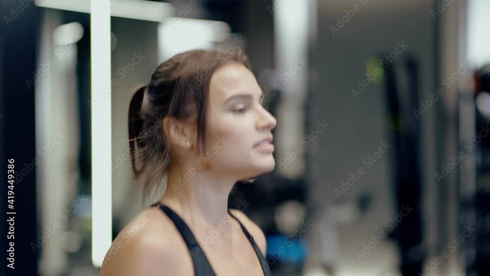 Smiling woman doing exercise on treadmill. Smiling woman doing exercise on treadmill.