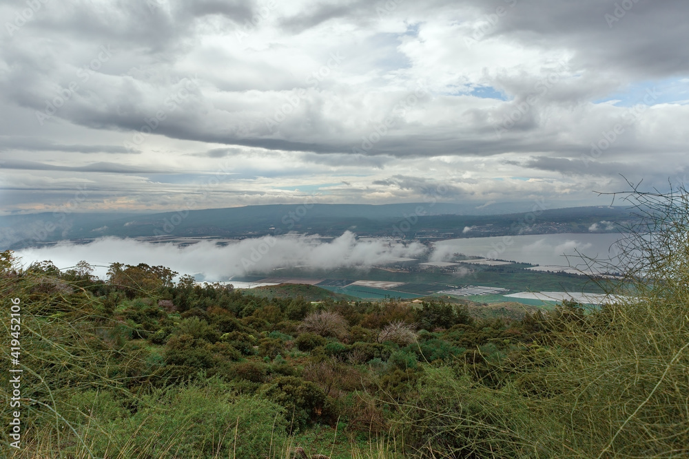 Panorama of the Kinneret lake on the background of beautiful clouds