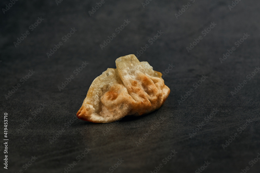 High angle of fried gyoza traditional oriental food placed on gray table High angle of fried gyoza traditional oriental food placed on gray table