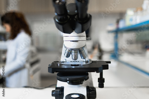 Closeup of contemporary professional microscope for professional scientific and medical research in modern lab