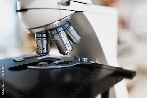 Closeup of contemporary professional microscope for professional scientific and medical research in modern lab